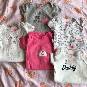 Bundle of newborn onesies